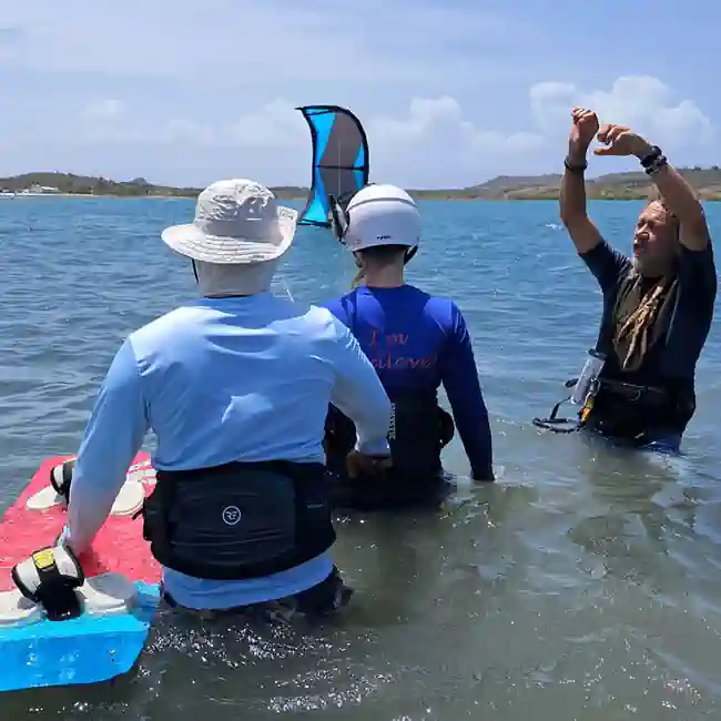 Guide 5 Two kitesurf instructors coaching one student at the St. Joris Bay Curacao